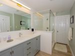 The master bathroom has an en suite bath with a walk in shower 